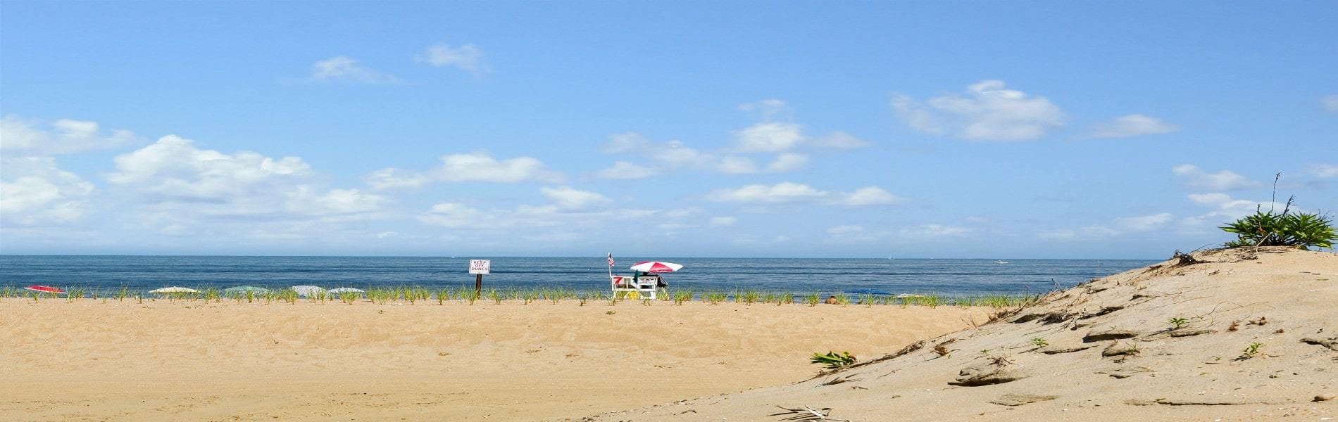 View of beach, water, and blue sky in Ocean County, New Jersey